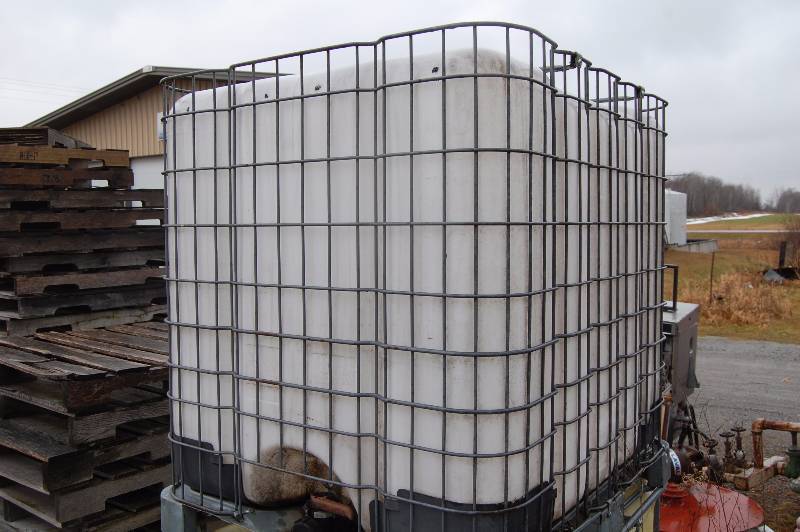 lot 268 image: Plastic Chemical Container with Steel Suppport Structure