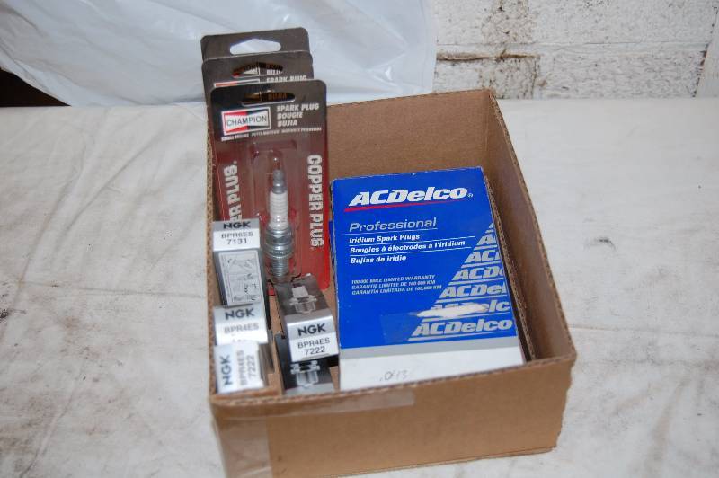 lot 534 image: Champion, AC Delco and NGK Spark Plugs