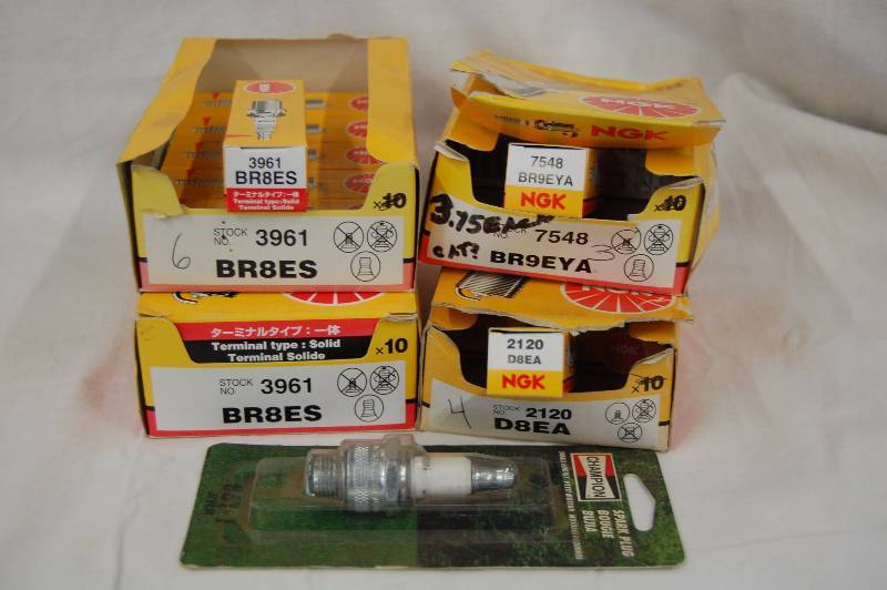lot 535 image: Champion and NGK Spark Plugs