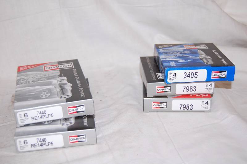 lot 548 image: Champion Spark Plugs