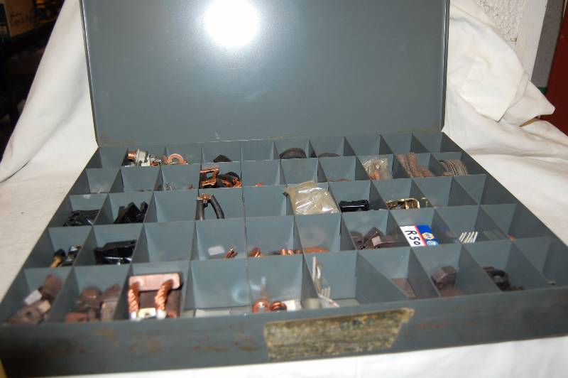 lot 554 image: Metal Storage Container With Alternator and Starter Parts