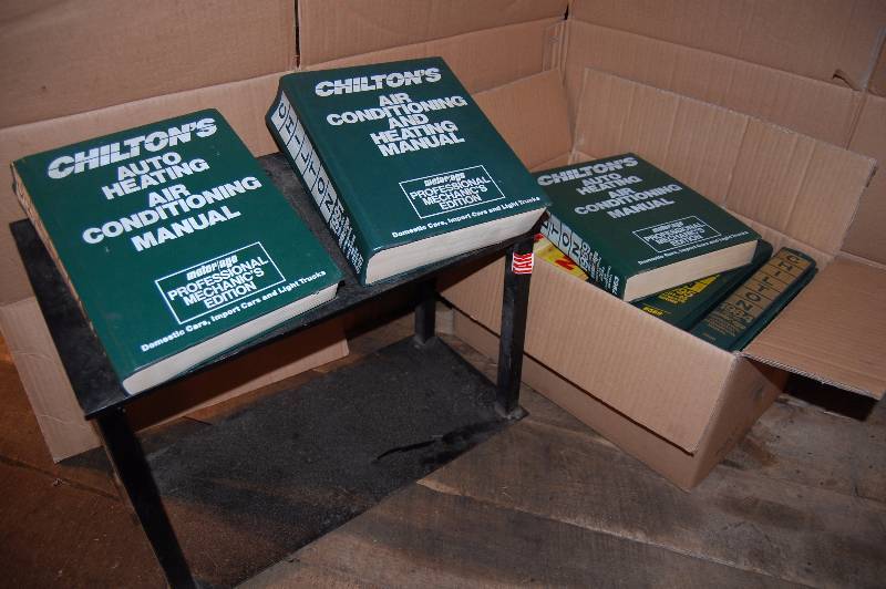 lot 782 image: Automotive Repair Shop Manuals and Manual Stand