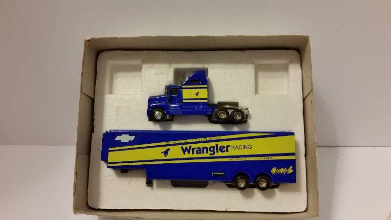 lot 65 image: Racing Collectables 1994 196th Scale Dale Earhardt Wrangler Racing 1985-86 UNOCAL Crew Champions Transporter - New in Box