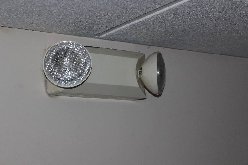 lot 2418 image: Lot of (26) Emergency Equipment Includes 9) EXIT Signs AND 11) Flood Lights AND 6) Fire Box