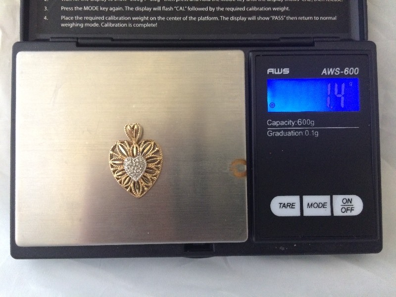 lot 10 image: 10K GOLD DIAMOND HEART PENDANT