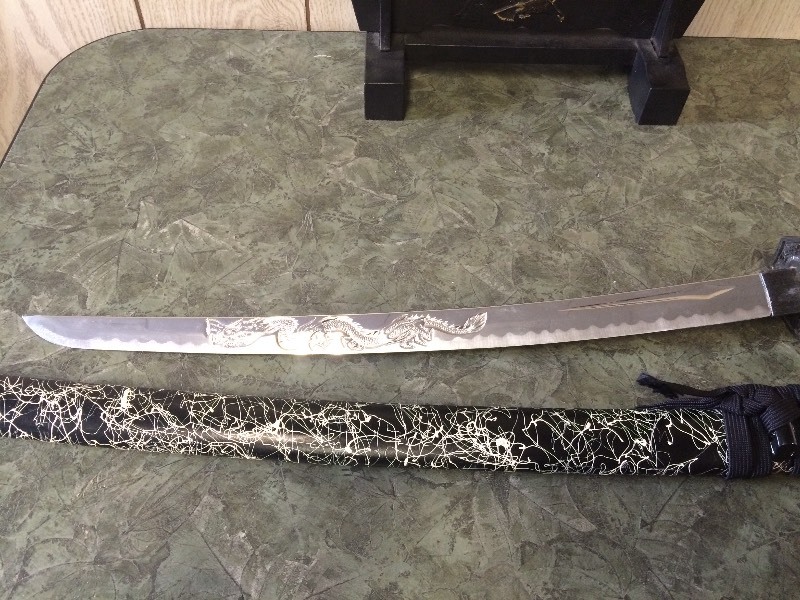 lot 18 image: 2 DECORATIVE SWORDS ON STAND
