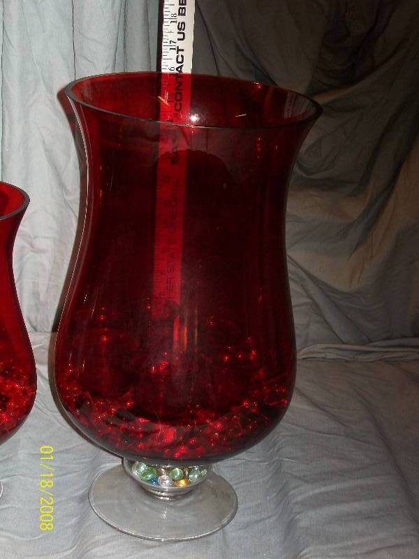 lot 17 image: 12 Piece Home Essentials & Beyond Holiday Red Hurricane Footed Candle Holder Set Includes Pebbles & Tea Candle Holders