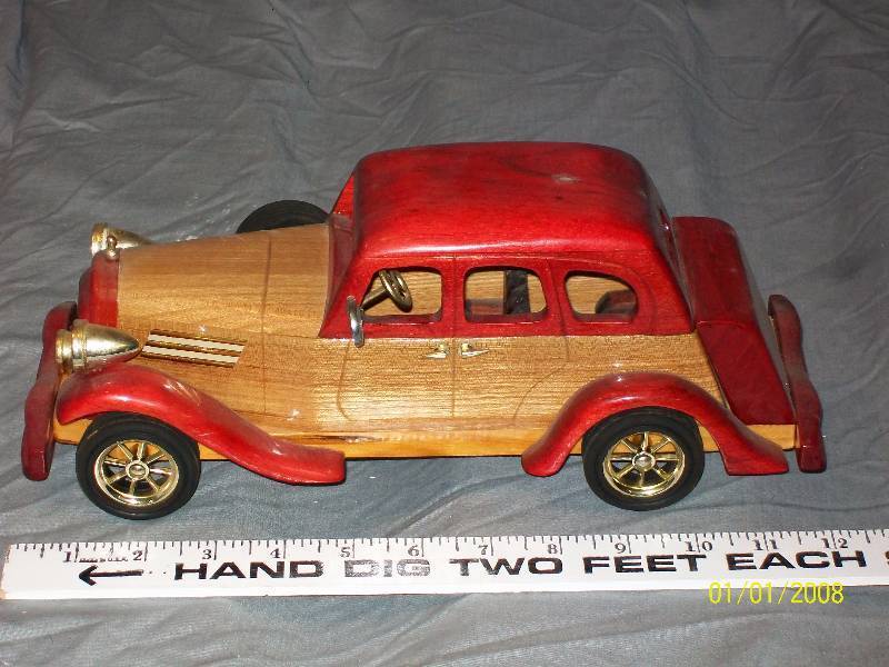 lot 31 image: Exquisite Multi Wood Touring Model Car with Rubber Wheels, 12 long