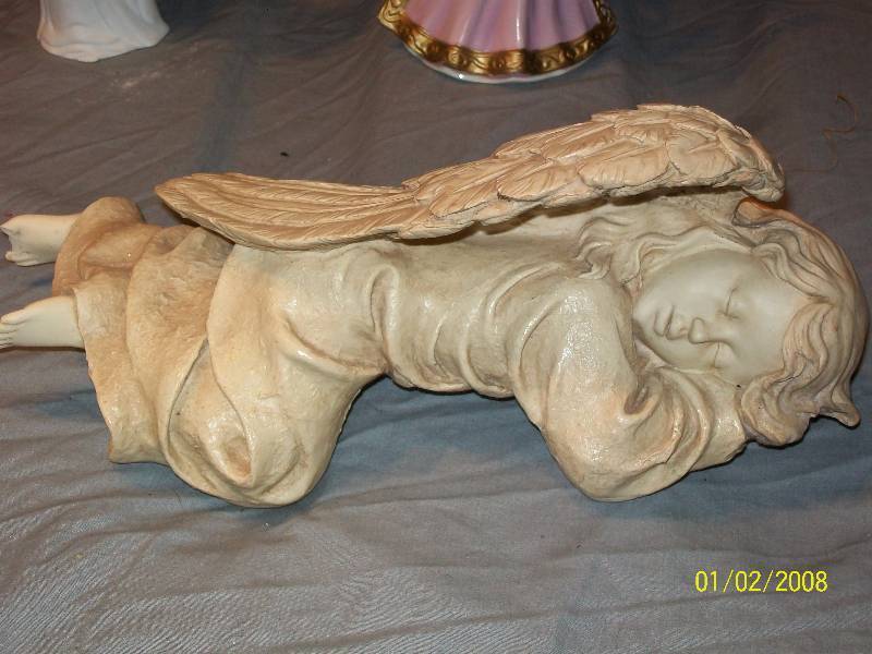 lot 37 image: 4 Angel Figurine Statues IncludesSleeping Shelf Angel Music Box AMC NY Angel Dept 56 MAM Cornucopia