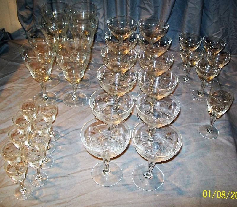 lot 41 image: 35 Piece Elegant Stemware with Swirling Frosted Clover design on Bowl with Clear StemBase.