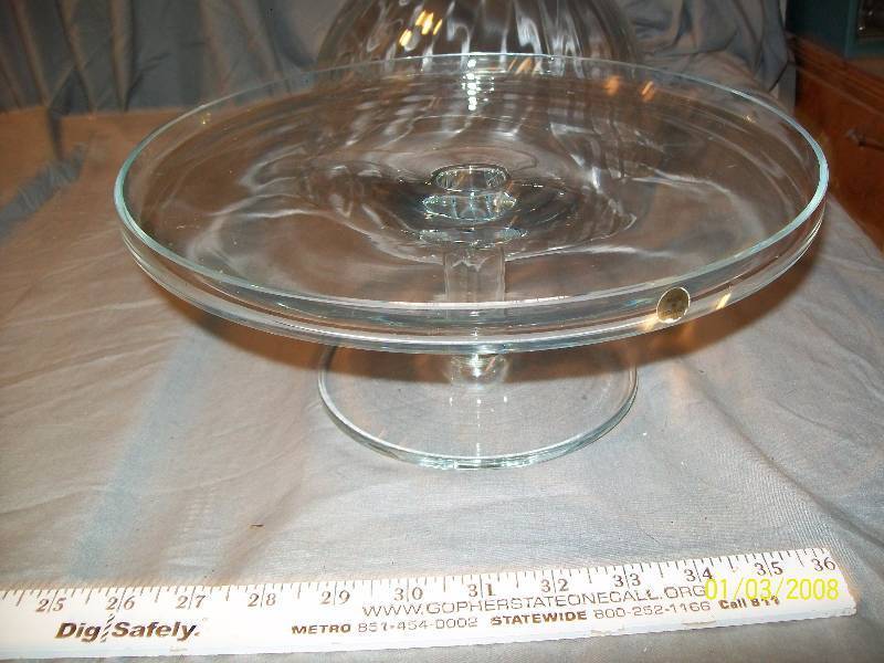 lot 66 image: 6 Piece Clear Glass Collection Includes 11 Poland Platter, Dome Platter Cover, Server, Ladle, Pedestal Container, 10 Tall Pitcher,