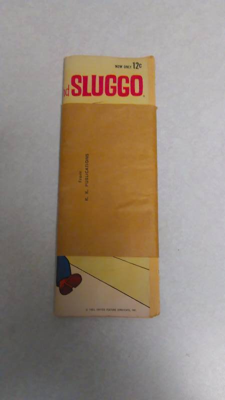 lot 77 image: Vintage comic book, Nancy and Sluggo. It includes the mailing sleeve and has never been out of the wrapper. K.K. Publications. It does have some edge and corner flaws but the inside is BRAND NEW. 