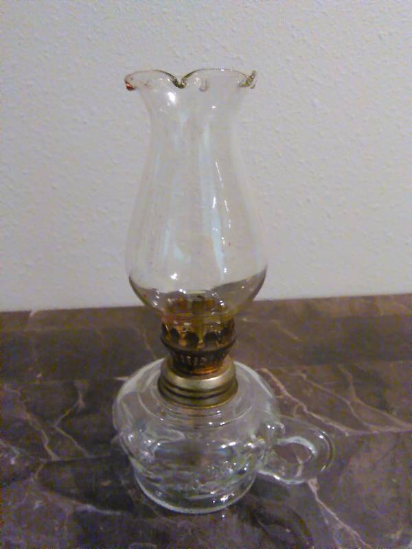 lot 82 image: Vintage Clear Glass oil lamp 8 inches tall