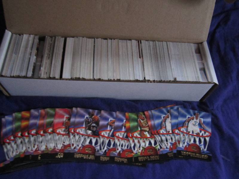 Box of press pass basketball cards...