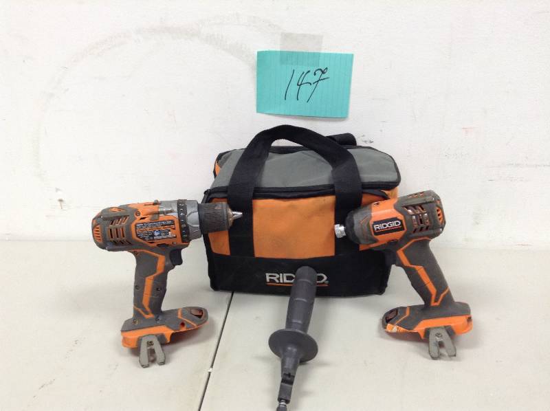 lot 147 image: RIDGID 18-Volt Lithium-Ion Cordless Hammer DrillDriver and Impact Driver used in working conditions tools only