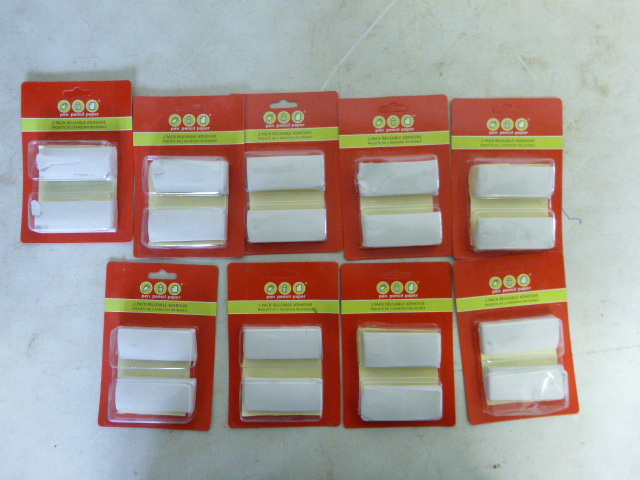 lot 560 image: 9 Packs of Reusable Adhesive