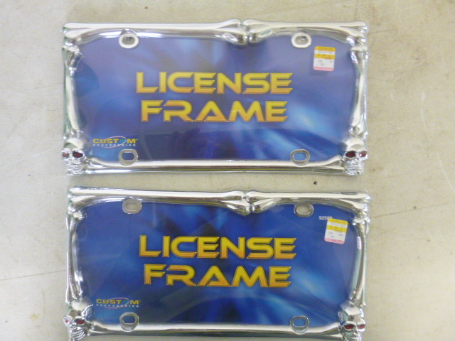 lot 120 image: 2 Skull License Plate Frames