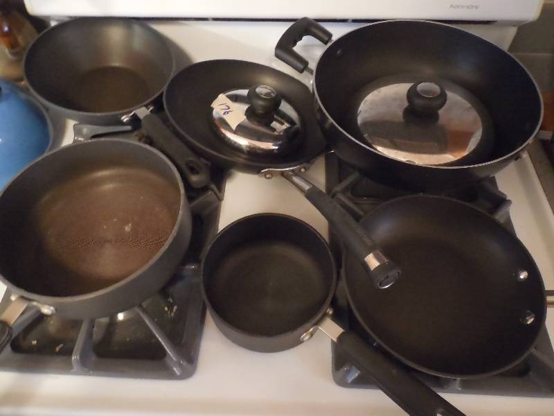 lot 176 image: 8 PIECE CAST IRON POTS AND PAN LOT