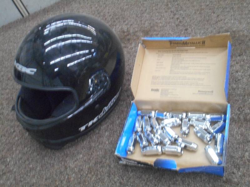 lot 103 image: (1) Snowmobile Helmet & (1) Lug Nut...