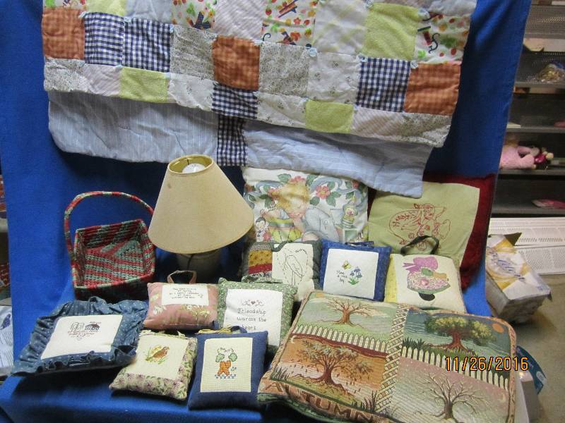 Lot of hand stitched pillows and qu...
