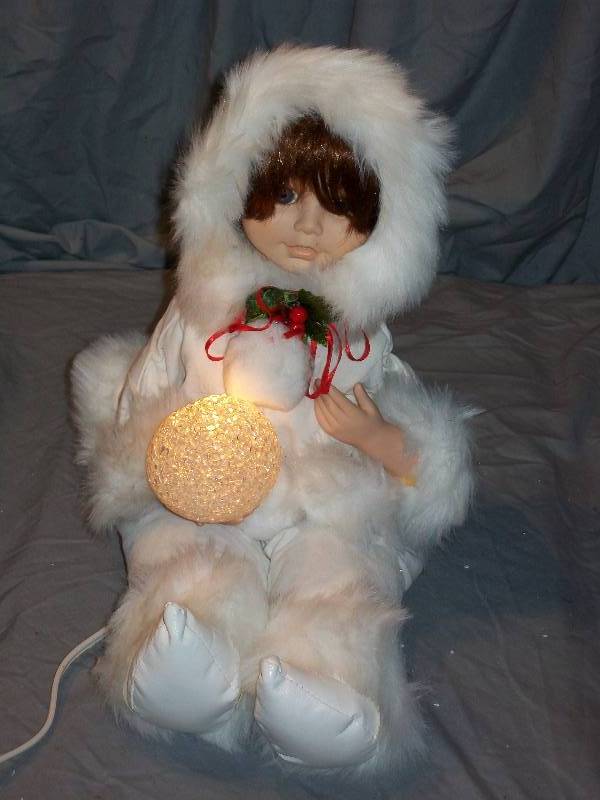 lot 8 image: See Video. 15 Telco Motionettes Eskimo Girl Doll with Light Up Snowball. Electronically Animated No Sounds. Christmas Decorations