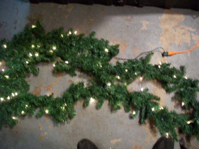 lot 18 image: 2-6 Clear Pre-Lit Artificial Green Garland & 7-6 Artificial Plain Green Garland.