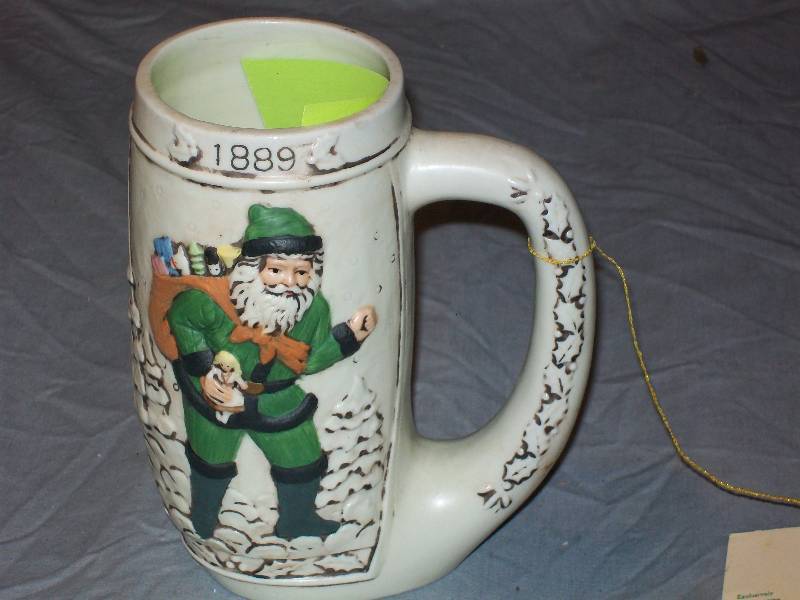 lot 43 image: 7-12 Tall 1987 CRI Memories of Legend Father ChristmasSanta Claus 1889 Beer SteinMug with Handle