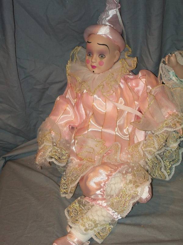 lot 59 image: 18 Pair of Child like Doll  Clowns with Finely Detailed Porcelain Faces, Hands & Clothing