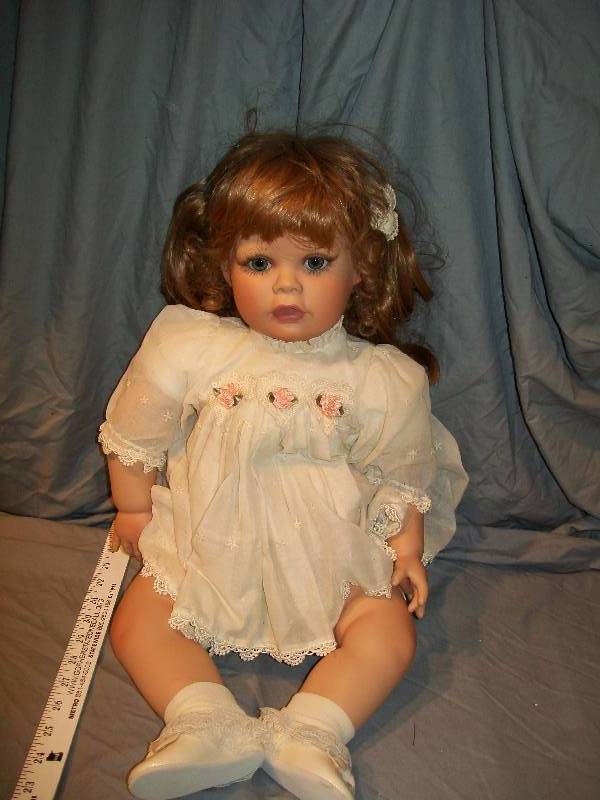 lot 62 image: 24 Baby Girl Doll 1994 Virginia E Turner Doll No. 267750 12898 on back of Neck, Detailed Face & Clothing.