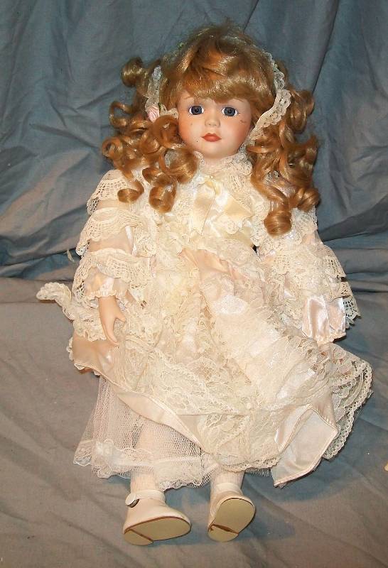 lot 65 image: 16 Doll Design Debut tm Series No. 18862069  Finely Detailed Face and Victorian Era Clothing,