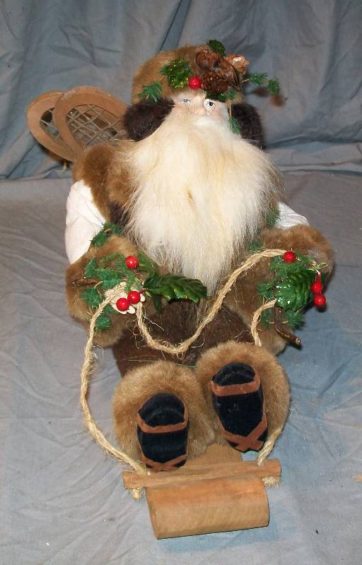 lot 89 image: 11 Rustic Father ChristmasSanta Claus Riding Wooden Toboggan Dressed in Faux Fur Trimmed Clothing