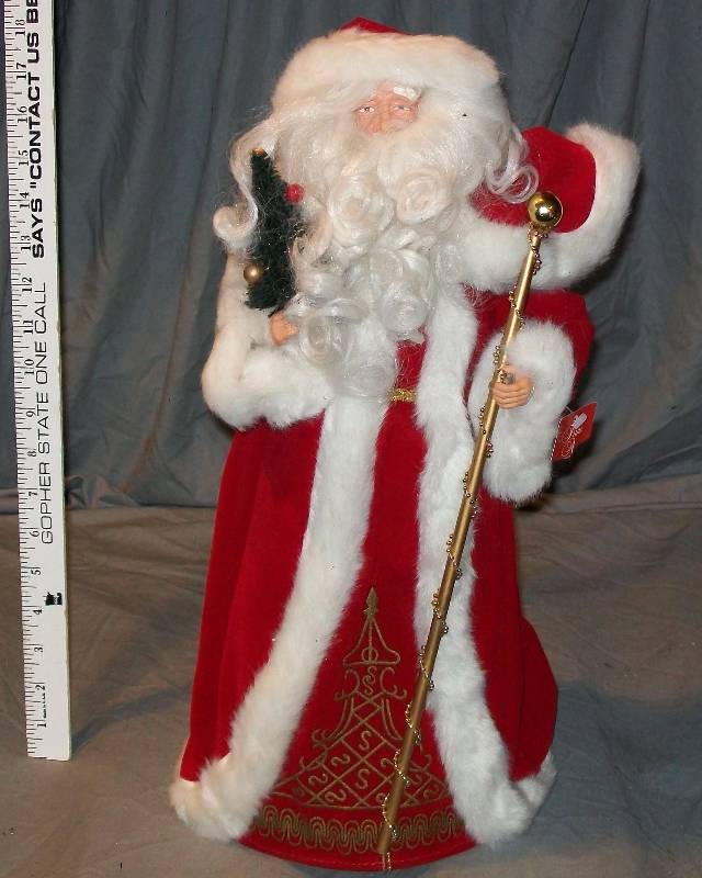 lot 97 image: 18 Father ChristmasSanta Claus Tree Topper Dressed In Red with White Faux Fur Trim.