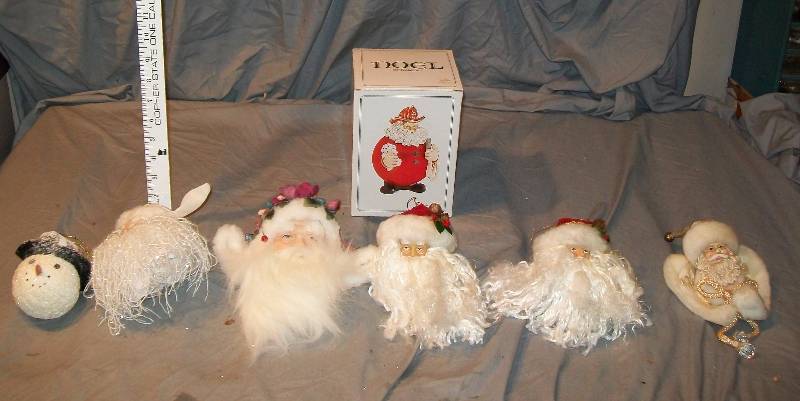 lot 99 image: 7- Hanging Ornaments 1-Fireman Santa Dept 56 5- Old Time Santa Head 1- Styrofoam Snowman Head