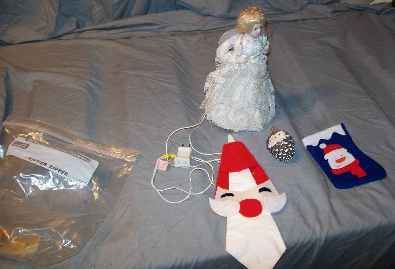 lot 129 image: Santa Napkin Holder, Small Angel Tree Topper (Did not light up when Plugged inUnknown Issue)