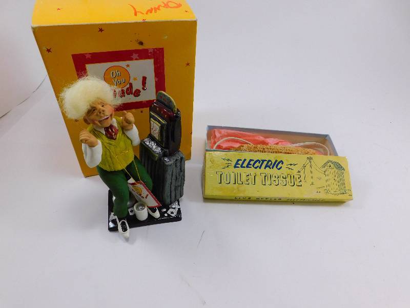 lot 43 image: Vintage Electric Toilet Tissue and Oh You Dude Figurine
