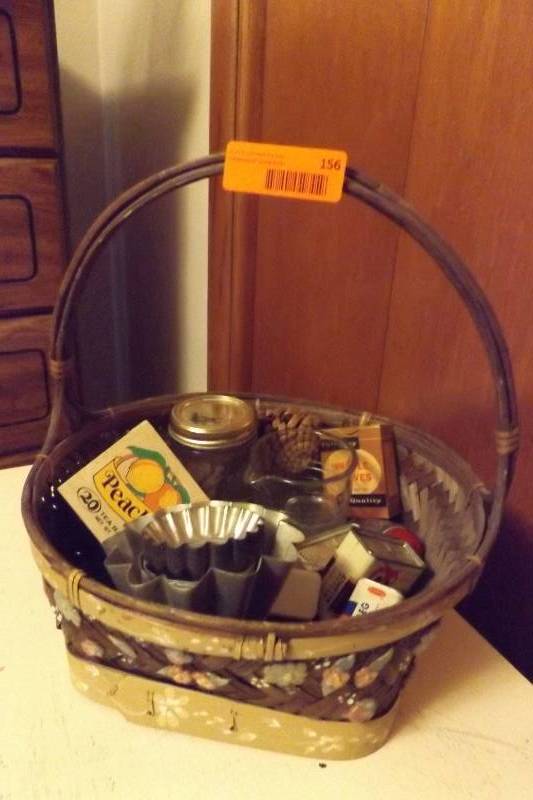 lot 156 image: Basket with vintage metal jello molds, tart makers, Mason jar, measuring cup,more