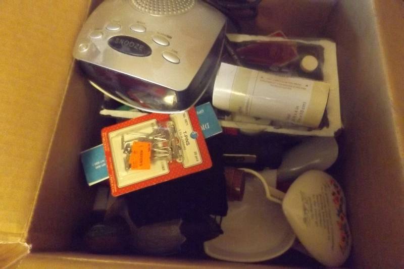 lot 193 image: Clock radio, flashlights, lint roller, trinket box, more