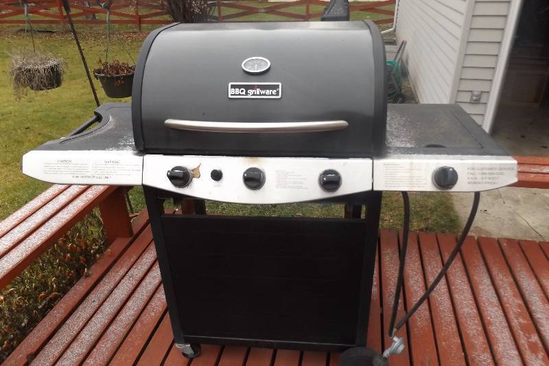 lot 195 image: Gas grill with propane tank, three internal burners, one side burner