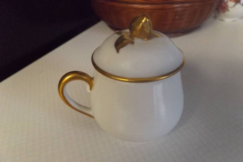lot 215 image: Limoges trinket cup with cover, white and gold, gold rose for handle on top