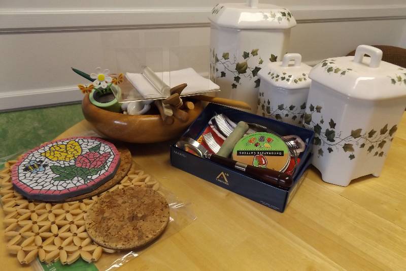 lot 233 image: Canisters (sm one broken and glued), coasters, kitchen small dcor, more