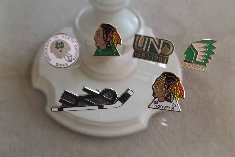 lot 454 image: Six UND Sioux pins