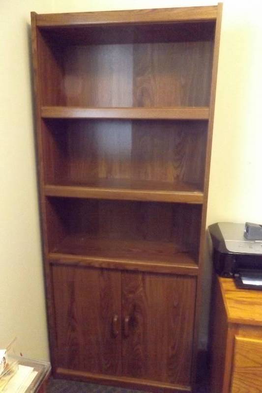 lot 461 image: Wood bookshelf with two lower doors