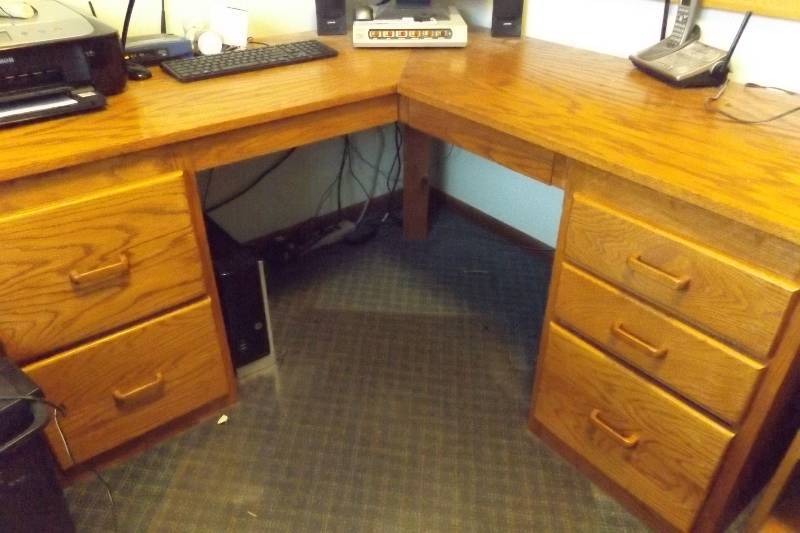 lot 469 image: Corner desk, two drawers on left, three drawers on right, supported by post  NOTE items on or in desk are NOT included in the lot, this lot is the desk only