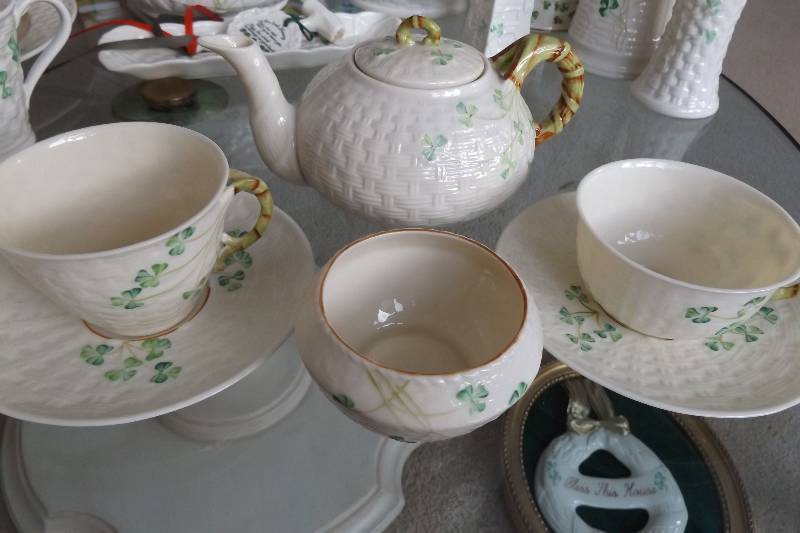 lot 480 image: Vintage Belleek china with brown trim, teapot, two different cups and saucers, small bowl