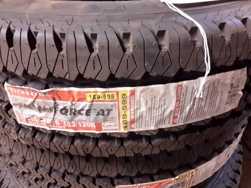 lot 43 image: 4, NEW Firestone Transforce AT Tires.. Still have paper over wheel tread