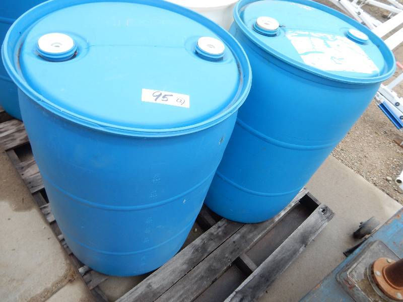 lot 95 image: 2 Plastic 55 Gallon Drums.. Not sure what was in them.. All covers in place