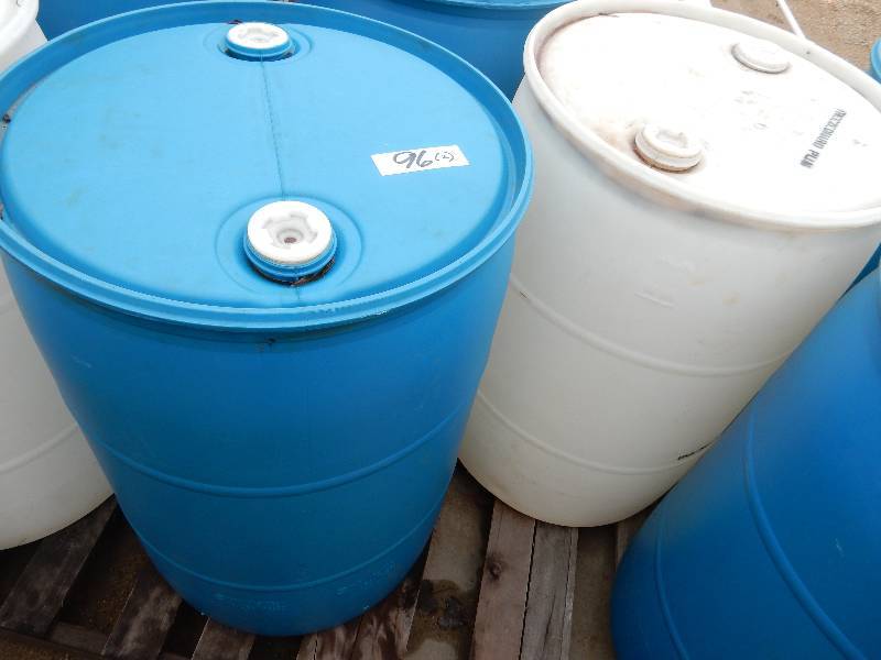 lot 96 image: 2 Plastic 55 Gallon Drums.. Not sure what was in them.. All covers in place