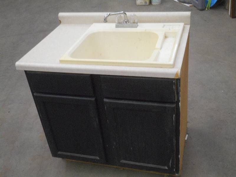 lot 72 image: ShopUtility Sink With Wood Vanity,...