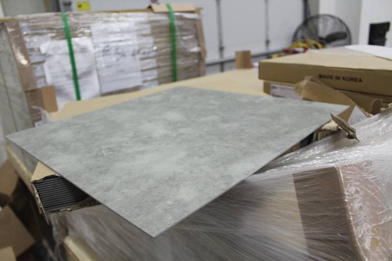 lot 39 image: 12 Pallet Lot of (Approximately 26) Boxes of Matworks 18x18in. Vinyl Tile