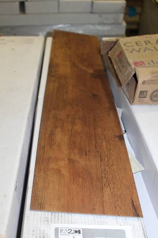 lot 102 image: Pallet Lot of (15) Boxes of Armstrong Commercial Natural Creations 36x8in. Weathered Oak Golden Brown Wood Vinyl Flooring